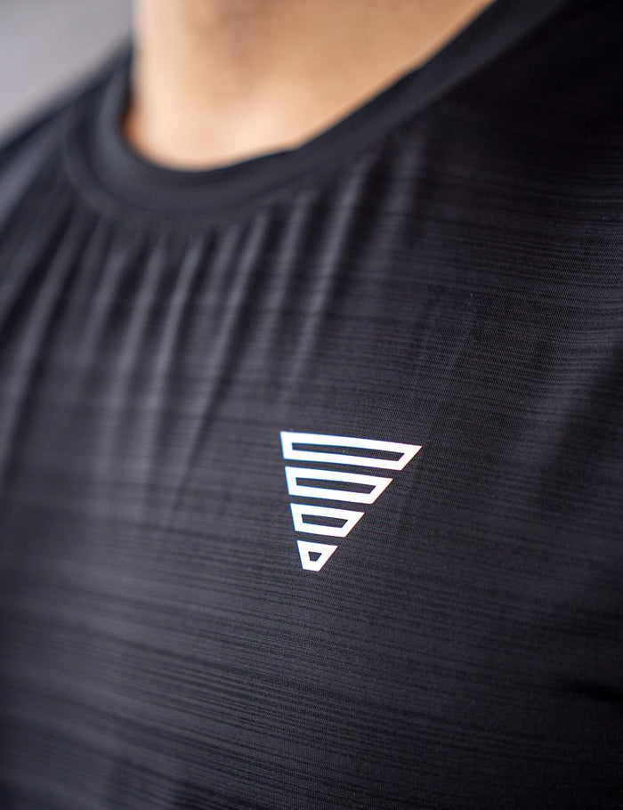 Close up of a GORNATION athlete wearing the GORNATION active tank top in black