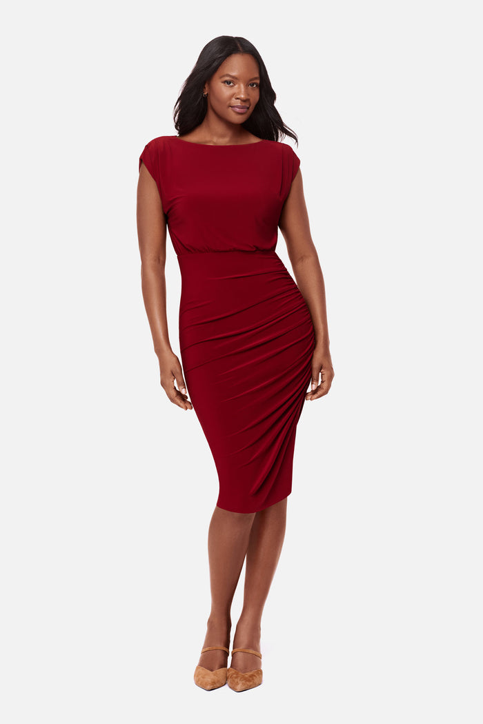 Woman wearing a bright red dress with a high neckline