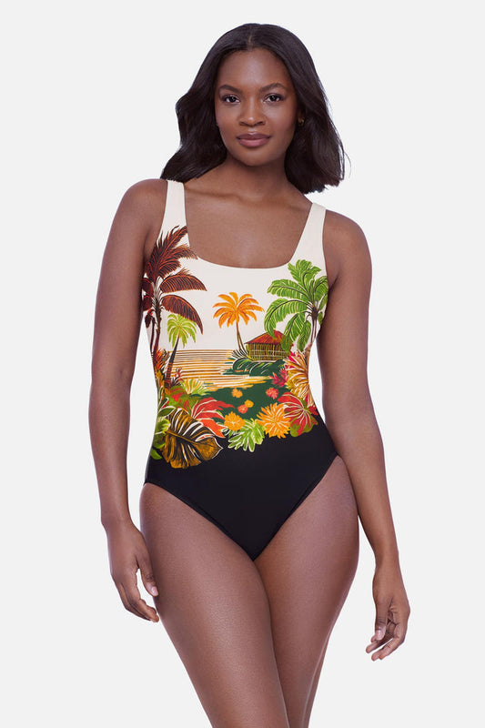 Woman wearing a tropical scene printed one-piece swimsuit