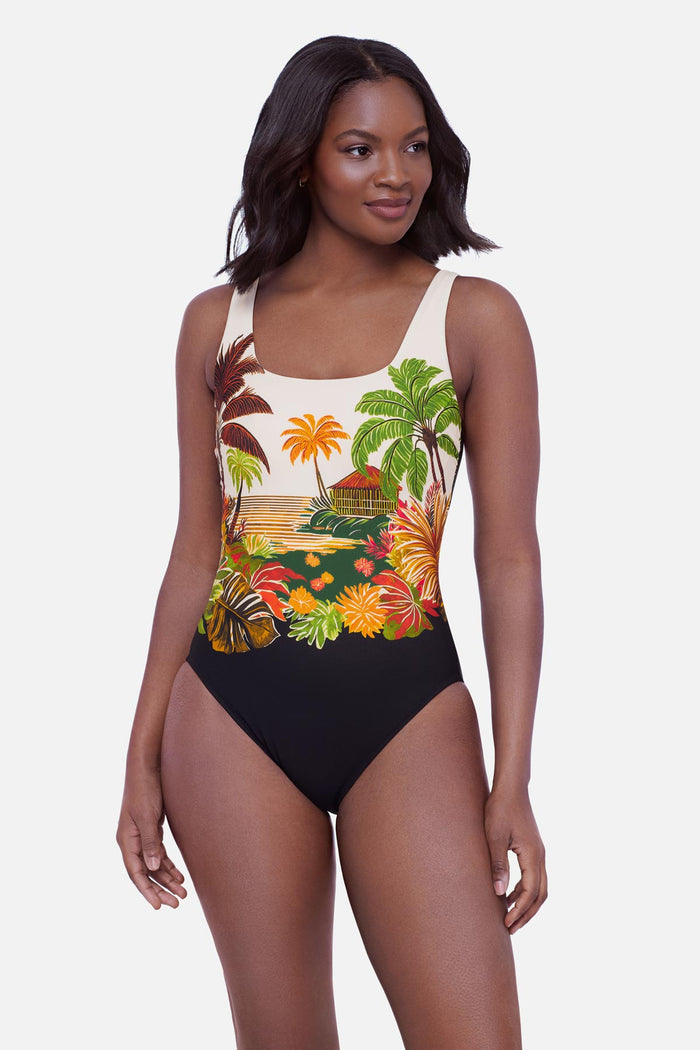 Woman wearing a tropical scene printed one-piece swimsuit