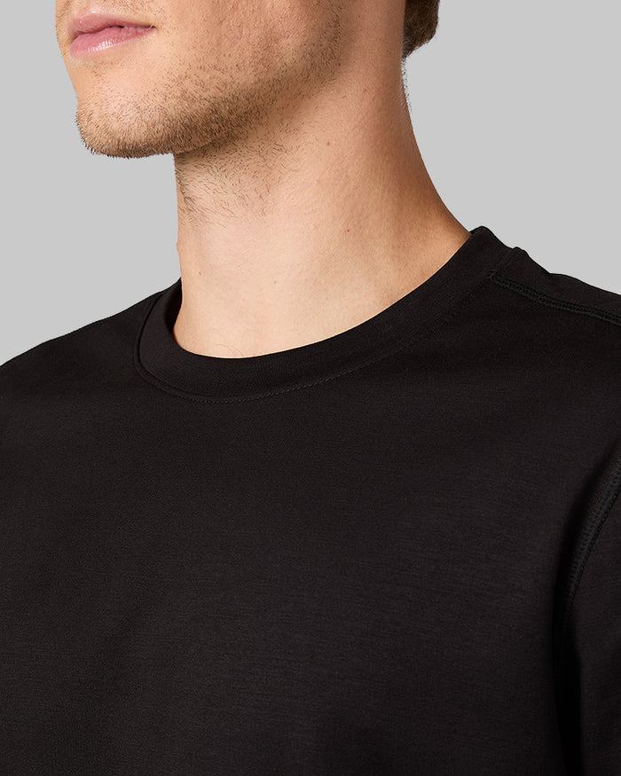32 Degrees Black _ Men's Luxe Flex Long Sleeve Crew Top {model: David is 6'2", wearing size M}{bottom}{right} {bottom}{right}