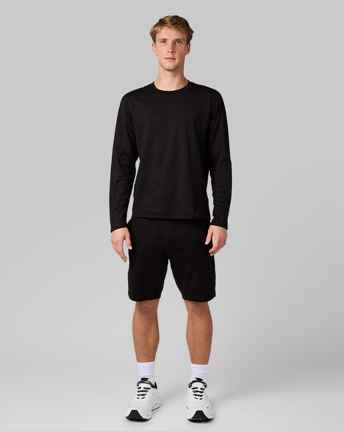 32 Degrees Black _ Men's Luxe Flex Long Sleeve Crew Top {model: David is 6'2", wearing size M}{bottom}{right} {bottom}{right}