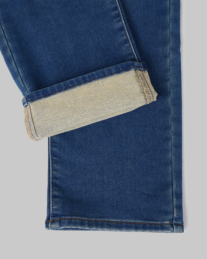 32 Degrees Medium Wash _ Men's Stretch Comfort "Sweatpant" Jean {model: Anthony is 6'0", wearing size M}{bottom}{right} {bottom}{right}