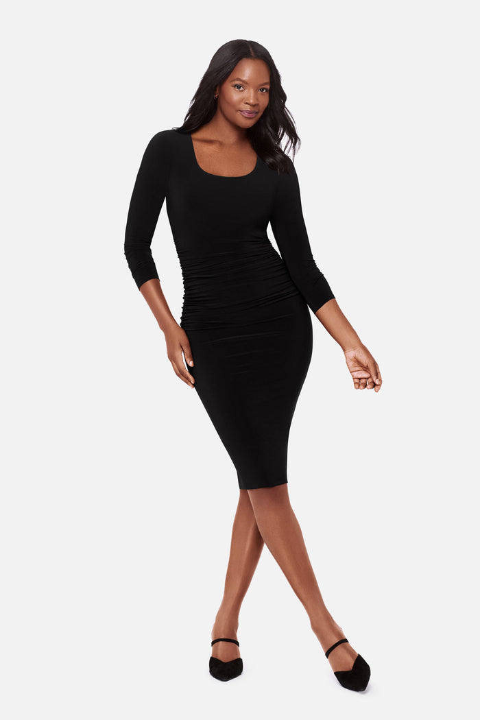 Woman wearing a long sleeve black dress