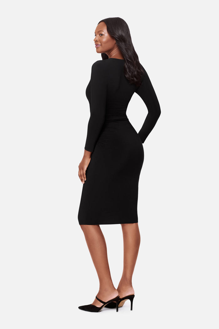 Woman turned left wearing a long sleeve black dress
