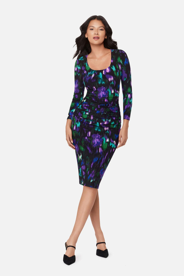 Woman wearing a multicolored print long sleeve dress
