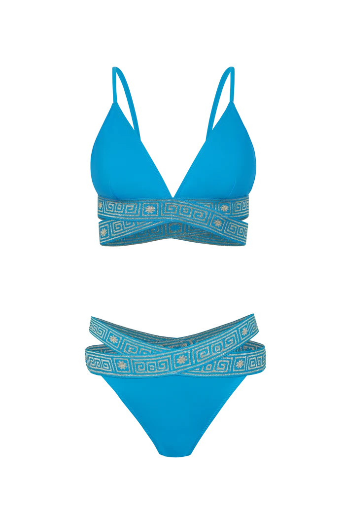 Blue bikini set with geometric patterns on a white background