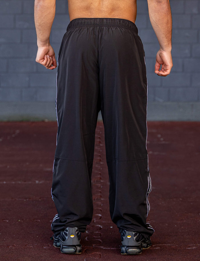 GORNATION athlete wearing the GORNATION tracksuite pants in black