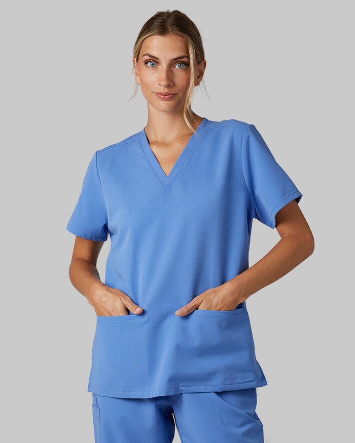 32 Degrees Blue Sky _ Women's 2-Pocket V-Neck scrub Top {model: Colby is 5'9"and size 4 wearing size S}{bottom}{right} {bottom}{right}