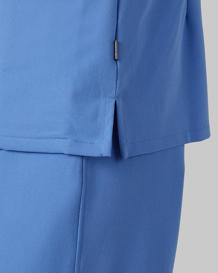 32 Degrees Blue Sky _ Women's 2-Pocket V-Neck scrub Top {model: Colby is 5'9"and size 4 wearing size S}{bottom}{right} {bottom}{right}