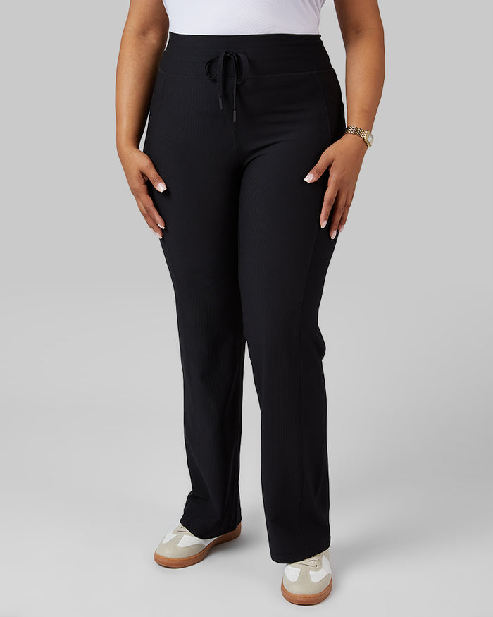 32 Degrees Black _ Women's High-Waist Active Rib Flare Pant {model: Jeharna is 5'9and size 14 wearing size L}{bottom}{right} {bottom}{right}
