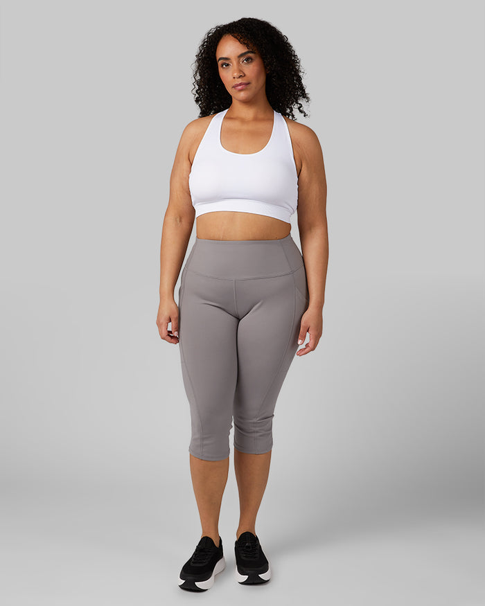 32 Degrees White _ Women's Seamless Racberback Sports Bra {model: Maria is 5'9" and size 14, wearing size L}{bottom}{right}