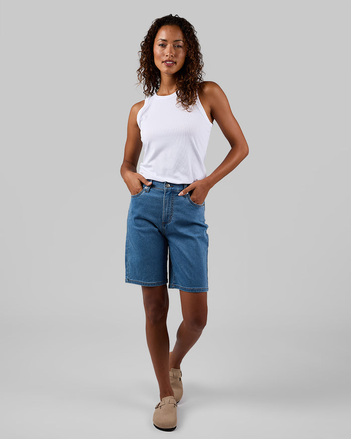 32 Degrees Medium Indigo Wash _ Women's stretch Comfort Jean Bermuda short  {model: Meli is 5'9.5"and size S wearing size 4}{bottom}{right} {bottom}{right}